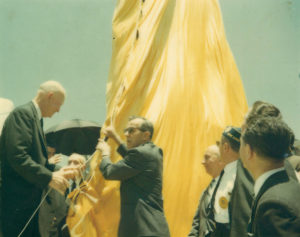 1964 US President Eisenhower raising a flag
