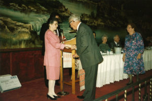 1994 UNA Jersey District 100th Anniversary Woman and Man Shaking Hands